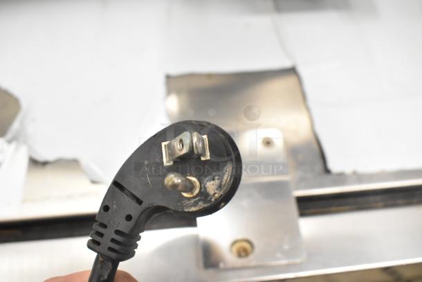 Close-up of a power plug for the GE Monogram ZDOD240PASS undercounter cooler. 115 volts, 1 phase.