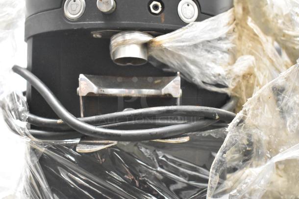 Mahlkonig K30ES/12 Commercial Espresso Grinder, no lid, 115V, 1 phase. Visible cords and buttons. Wrapped in plastic.