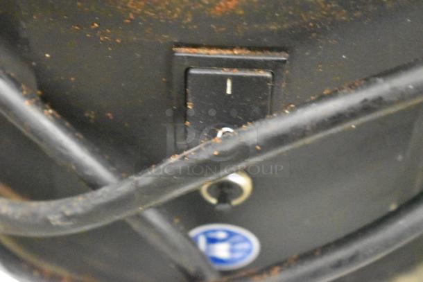 Mahlkonig K30ES/12 grinder, missing lid, shows signs of wear, 115V, 1 phase. Features power switch and manufacturer label.