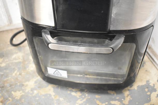 Home HME010387N countertop air fryer oven, 120 volts, 1 phase. Features a metal handle and clear viewing window. Condition: used.