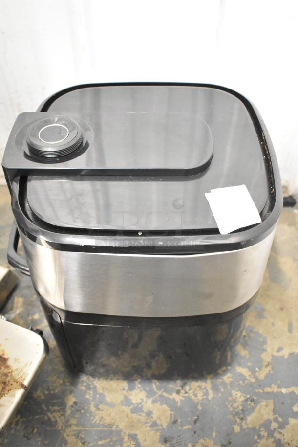 Home HME010387N countertop air fryer oven, 120 volts, 1 phase, used condition. Features stainless steel finish and control knob.