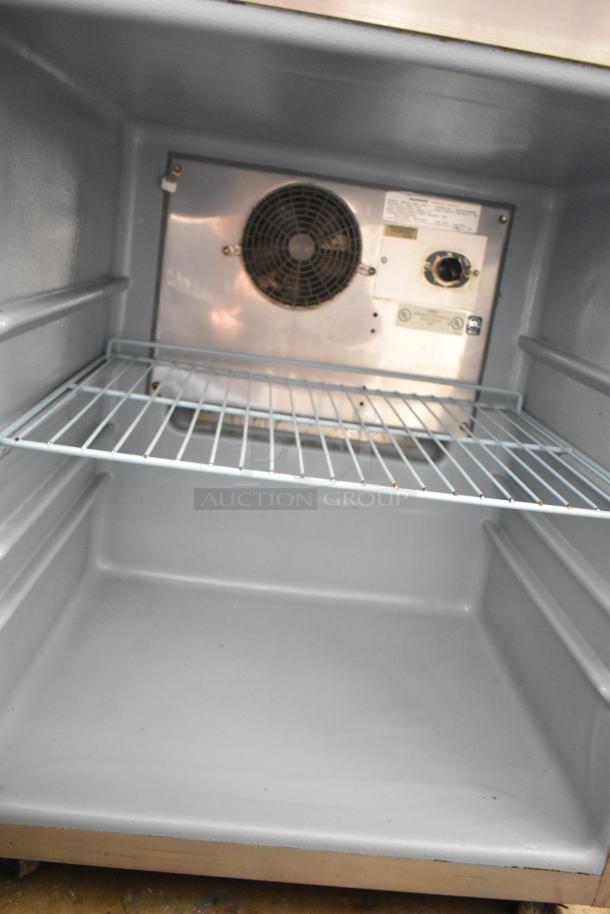 Delfield 406CA-DHL-DD1 commercial undercounter cooler, single door, 115 volts, 1 phase, interior view with wire shelf and fan.