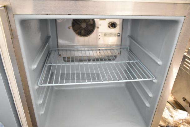 Delfield 406CA-DHL-DD1 single door undercounter cooler, 115V, 1 phase, interior view with wire shelf, clean condition.