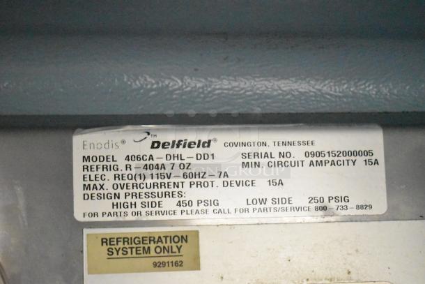 Delfield 406CA-DHL-DD1 commercial cooler label; shows model, voltage (115V), phase (1), and refrigeration details.