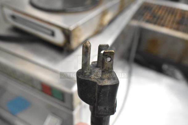 Bunn countertop 3 burner coffee machine, 15 volts, 1 phase, visible power plug in used condition.