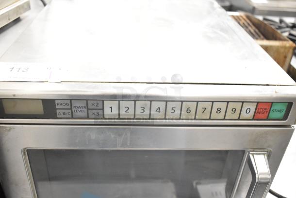 Panasonic NE-17523 commercial microwave, keypad control, 208/240 volts, good condition, visible control panel and buttons.