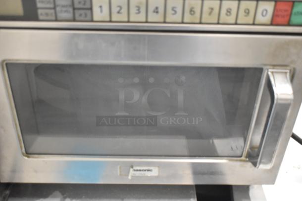 Panasonic NE-17523 commercial countertop microwave oven, stainless steel, keypad, 208/240 volts, used condition.