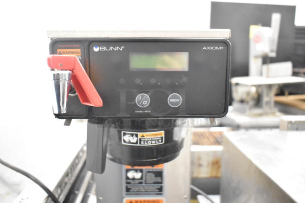 2018 Bunn AXIOM-DV-APS commercial airpot coffee brewer with hot water dispenser, features digital controls and warning labels.