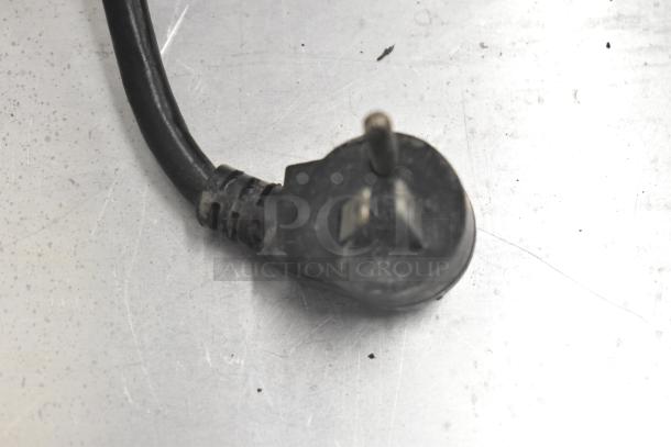 Close-up of a plug from a Delfield 406CA-DD1 undercounter cooler, showing wear. 115 volts, 1 phase.