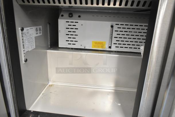 Brand new 2022 Kutano JUT 2 4D PT Sandwich Prep Table, minor scratches, stainless interior, commercial casters, 115V, 1 Phase.