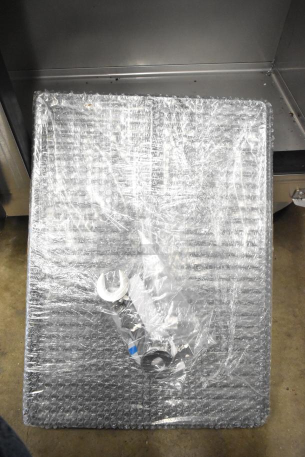 Brand new Kutano JUT 2 4D PT prep table with bubble wrap, includes tools. Scratch and dent condition, 115V, 1 Phase.