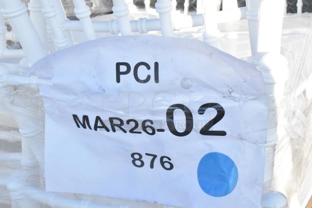 White resin Chiavari chairs, new with scratches and dents. Tag reads "PCI MAR26-02 876" with a blue dot.