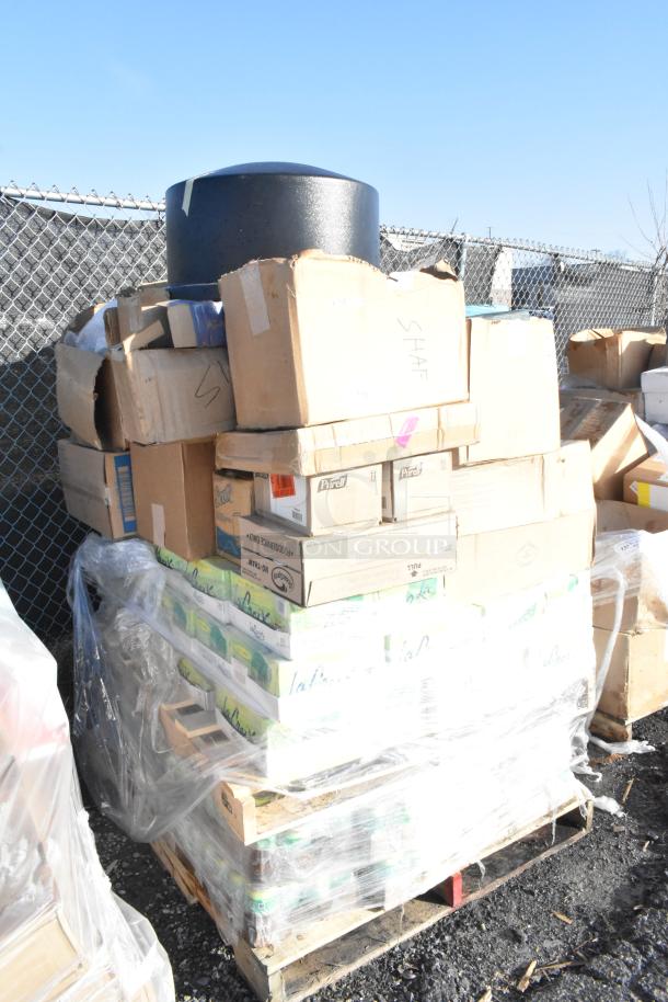 Bulk lot of 65 new scratch and dent items, including La Croix sparkling waters and crackers, on a wrapped pallet.