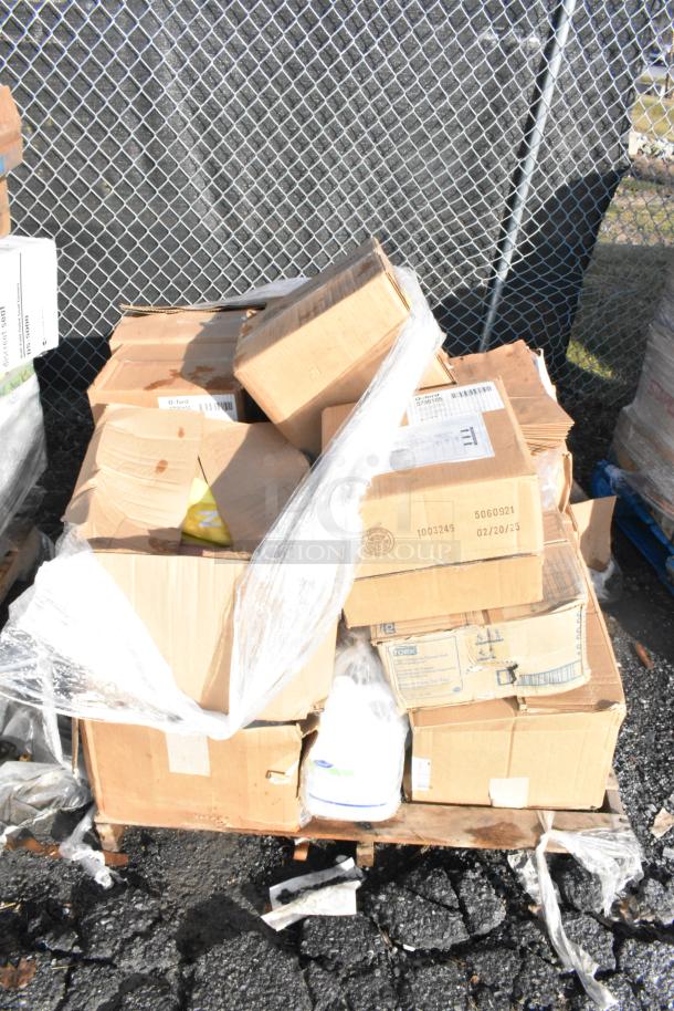 Pallet of 15 unopened boxes labeled for various items, including shelf liners, wrapped in plastic, minor box damage visible.