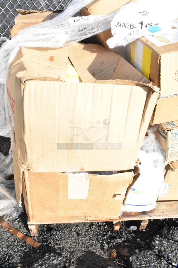 Cardboard boxes containing 15 brand new scratch and dent items including shelf liners, labeled "JAN26-168."