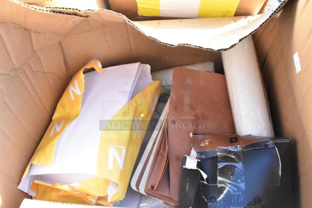 Box containing 15 brand new scratch and dent items, including shelf liners. Torn packaging visible.