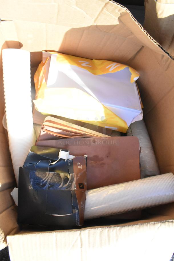 Box of 15 scratch and dent items including shelf liners. Items are brand new, visible in original packaging.