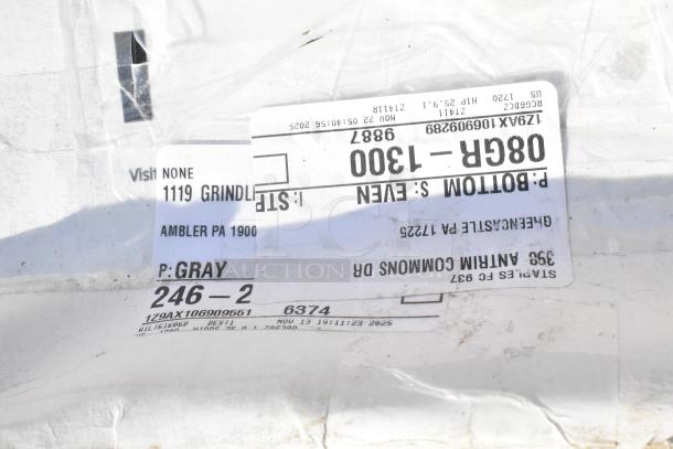 Auction items label, showing model and location details, indicates new scratch and dent items including shelf liners.