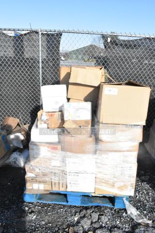 Pallet with 32 boxed items including toilet seat covers, laundry bags, power cleaner; mixed conditions, shrink-wrapped.
