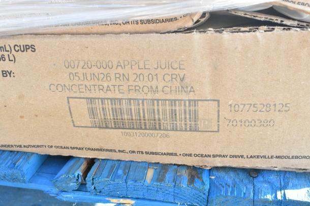 Cardboard box labeled "Apple Juice", with readable barcode and markings indicating concentrate from China. Items are scratch and dent sale.
