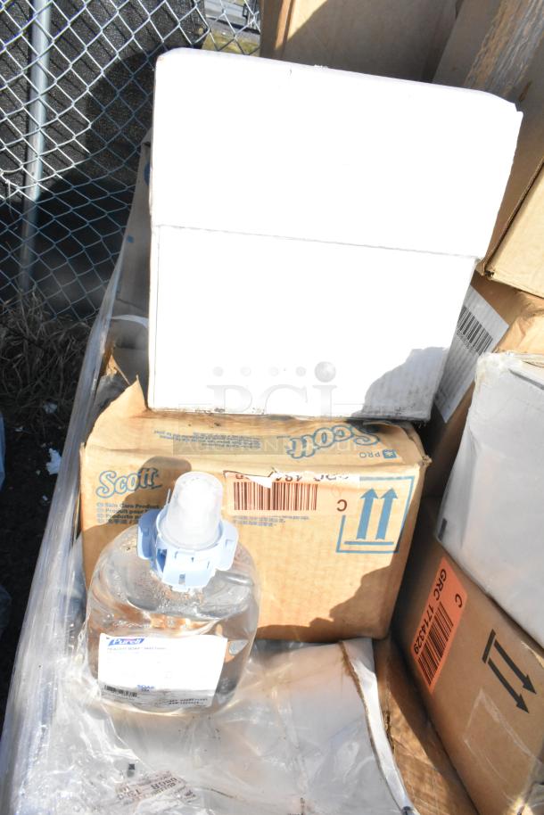 Brand new mixed items in boxes, including Scott toilet seat covers. Includes scratched and dented items.