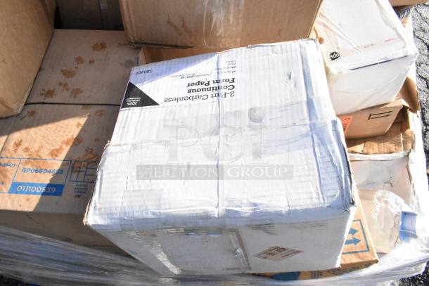 Box of scratch and dent items, including toilet seat covers and laundry bags. Visible box labeled "2-Part Carbonless Form Paper."