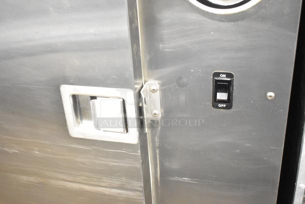 Plate Mate Commercial Heated Holding Cabinet with metal handle and on/off switch, in good condition.