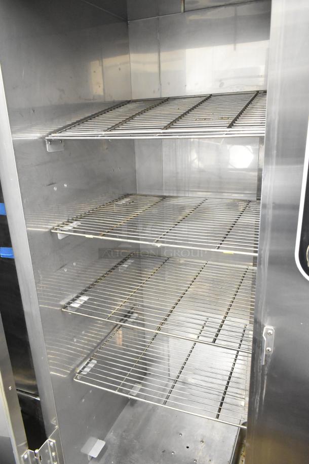 Plate Mate commercial heated holding cabinet with multiple wire shelves on commercial casters, stainless steel, good condition.