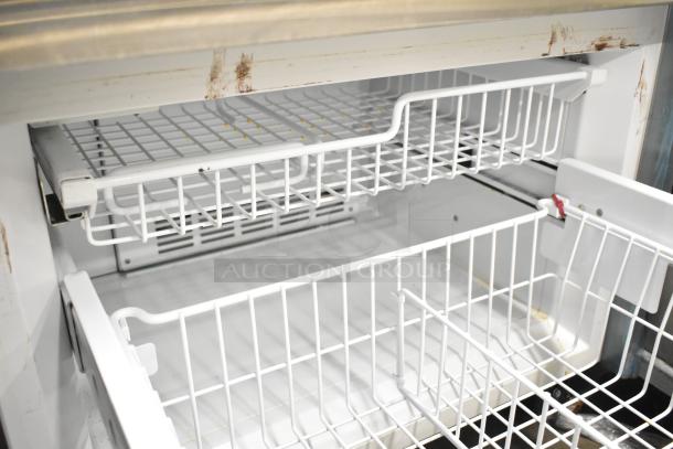 Sub Zero BI-30U/S/TH cooler with freezer drawer, showing used interior shelves, mild discoloration, runs on 115 volts, 1 phase.