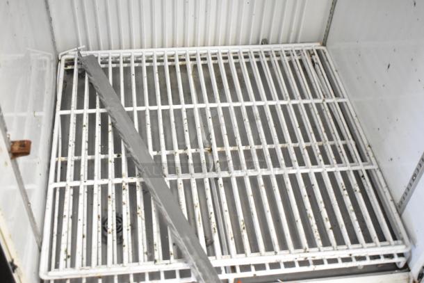 Minus Forty 22-USGF-X1-BBR freezer interior showing wire shelving, visible wear. Ideal for commercial use, 115V, 1 phase.