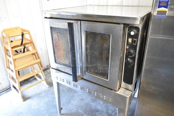 Blodgett commercial full-size convection oven with view-through doors, thermostatic controls, and metal legs in used condition.