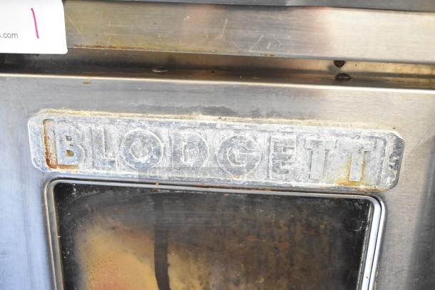 Blodgett commercial full-size convection oven with view-through doors, thermostatic controls, and metal legs. Signs of wear visible.
