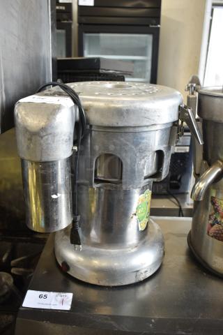 WF-A2000 countertop juicer, 110V, 1 phase, stainless steel body, visible wear. Model label reads "WF-A2000."