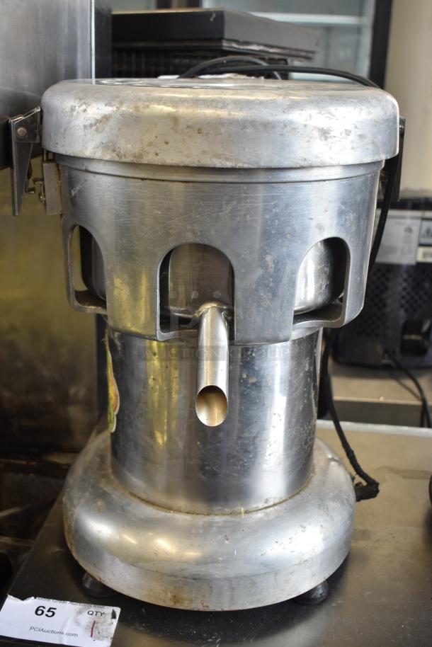 WF-A2000 Countertop Juicer, 110 Volts, 1 Phase. Visible wear, stainless steel body, front spout, model label intact.