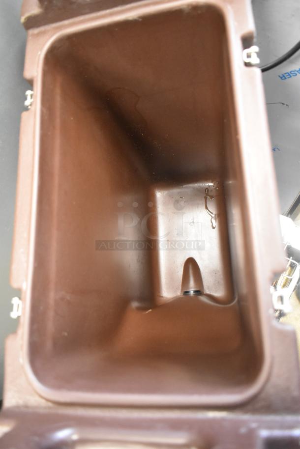 Brown Cambro poly beverage holder dispenser, interior view, sturdy design, good condition, ideal for catering.