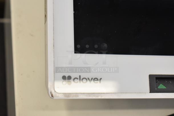 Clover C305 Mini POS monitor, with visible logo, edge wear.