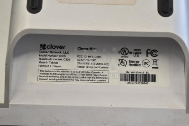 Clover POS System with Clover C305 Mini POS monitor, readable label showing manufacturing details and compliance info.