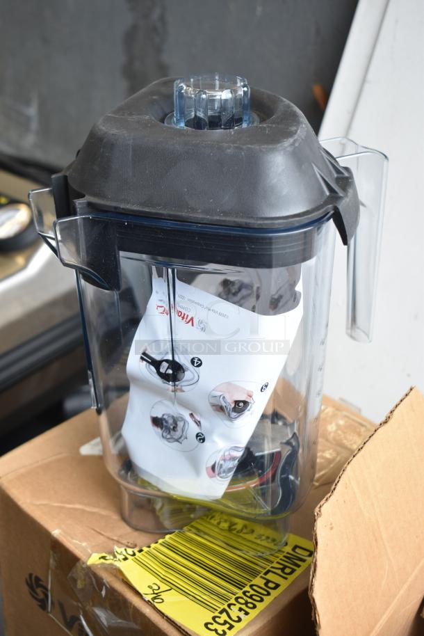 VitaMix blender pitcher with black lid, clear container, instruction sheet inside; part of a 5-item auction set.