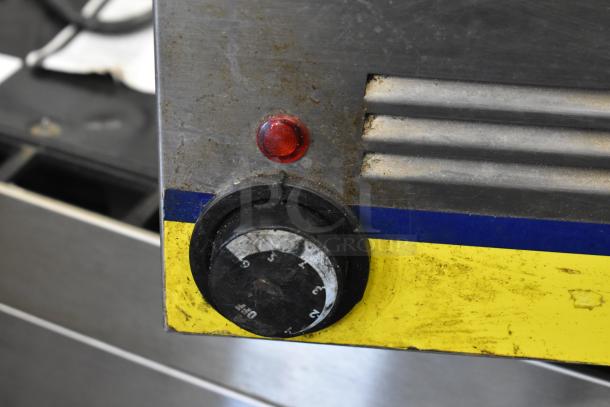 Qualite FW-1200WF Countertop Food Warmer, 120V, 1 Phase, metal control panel with temperature dial and indicator light, signs of use.