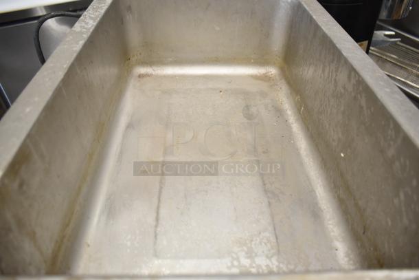 Qualite FW-1200WF Countertop Food Warmer, 120 Volts, 1 Phase, stainless steel, visible use signs.