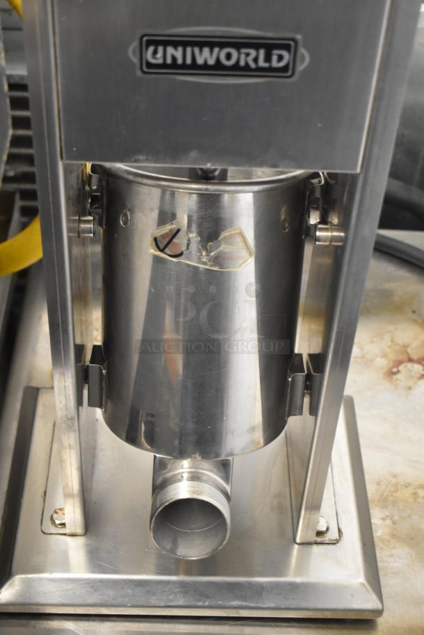 Uniworld countertop sausage stuffer, stainless steel, visible logo, slight wear, efficient design for easy use.