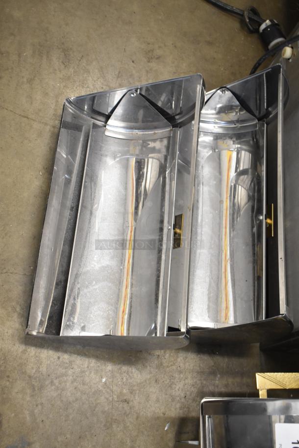 Countertop roll top chafing dish with two extra lids, stainless steel, reflective finish, good condition, no visible markings.