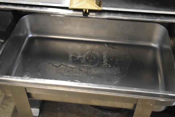 Countertop roll top chafing dish with two extra lids; stainless steel, water droplets visible, used condition.