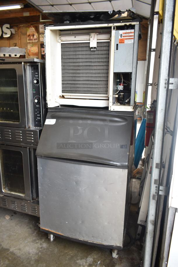 Manitowoc SY0854A ice head on bin, 208-230V, 1 phase, stainless steel, commercial use, some wear visible.