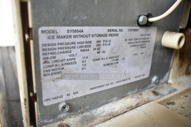 Manitowoc SY0854A ice machine label showing model, serial number, voltage, and specifications.