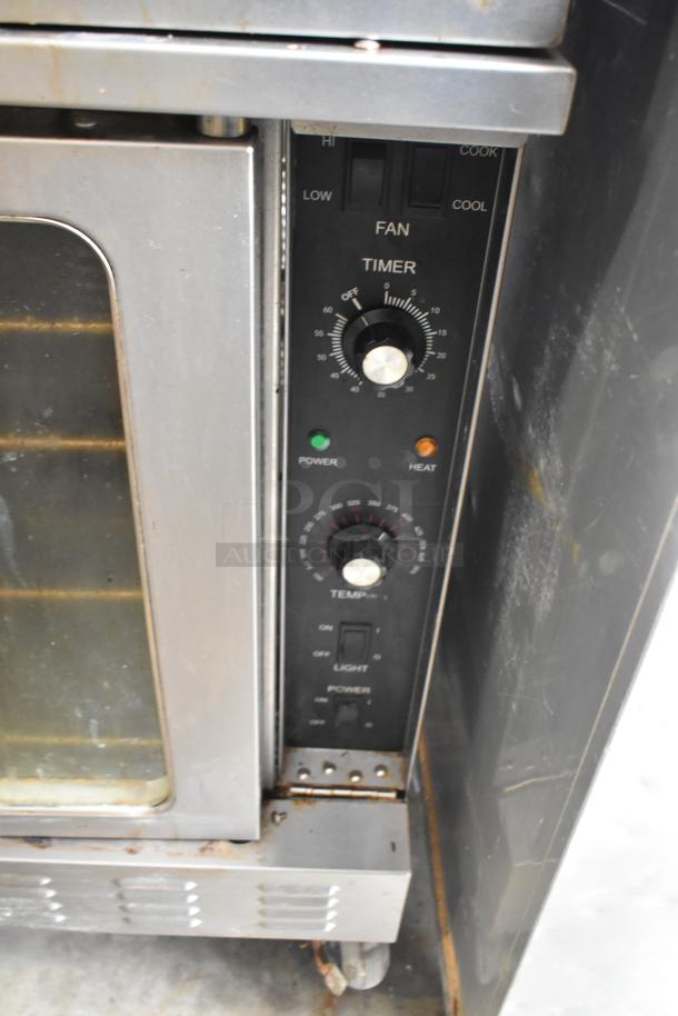 Seagate full-size convection oven with view-through door, thermostatic controls, and commercial casters.