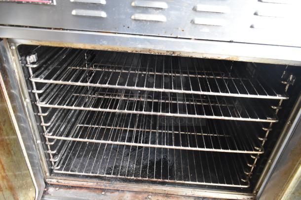 2 Seagate full-size convection ovens with view-through doors and thermostatic controls on casters. Used condition.