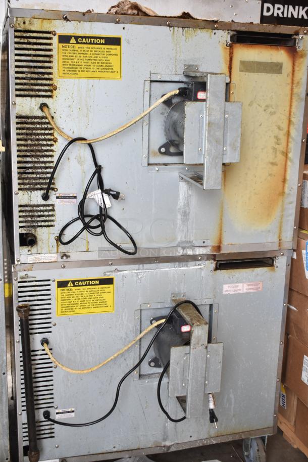 Seagate commercial convection ovens with view-through doors, thermostatic controls, on commercial casters. Visible wear.