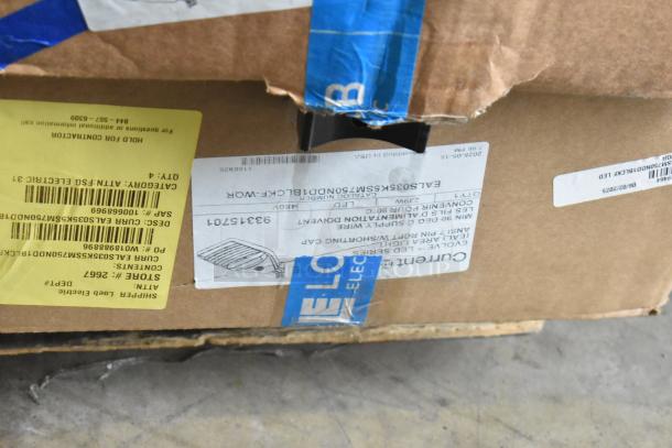 Box containing Evolve LED Series Area Lights, labeled with product details and shipping information, in damaged condition.