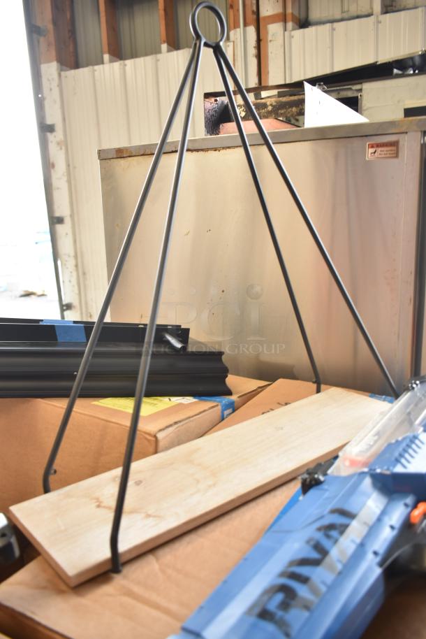 Mixed auction items including Evolve LED Series area lights and various tools and materials, in fair condition.